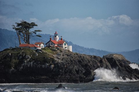 Battery Point Lighthouse in Crescent City, California overlooks the crashing waves of the Pacific Ocean.  This is a 150-plus year old lighthouse that is still active.